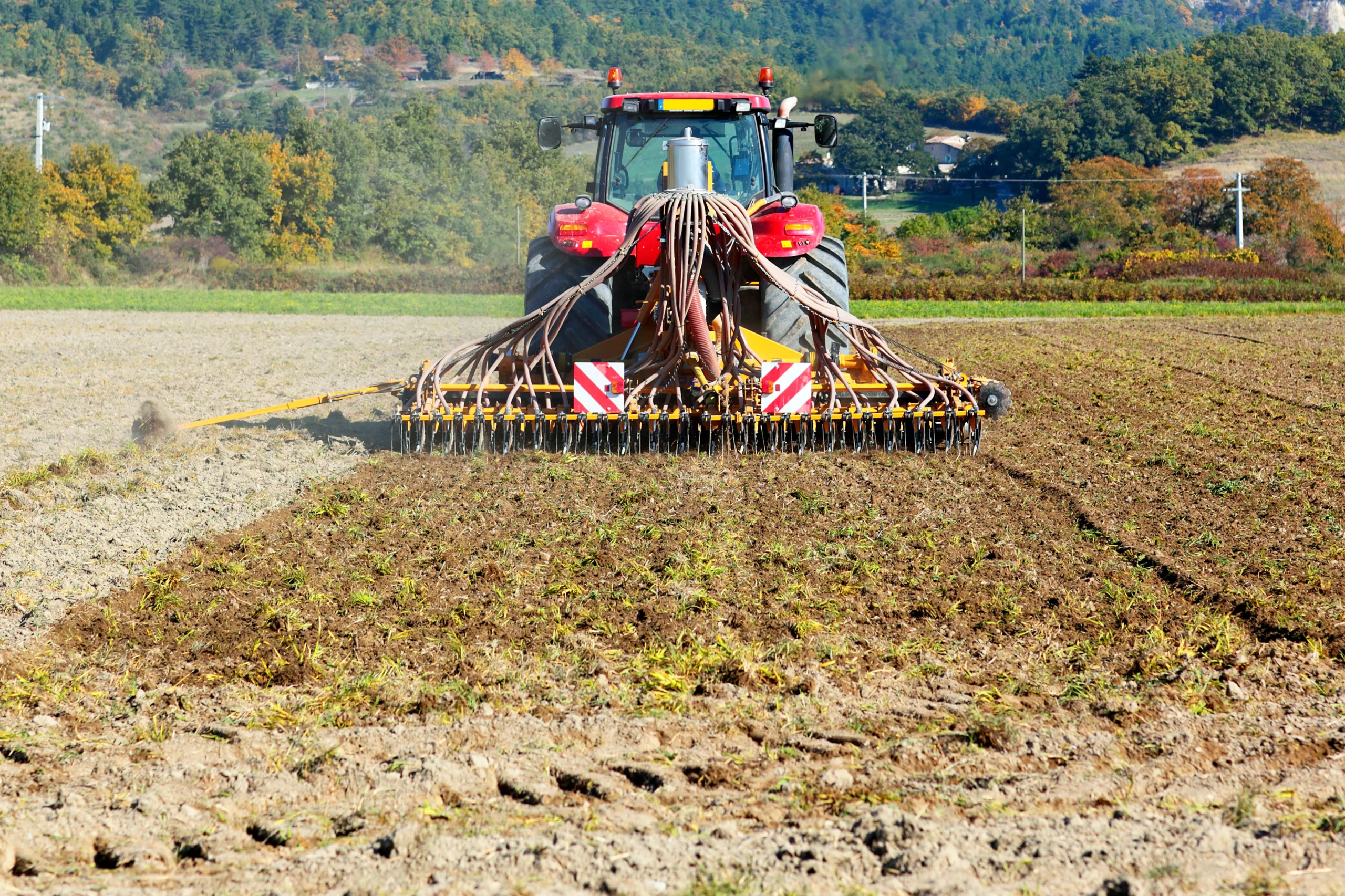 ploughing-heavy-tractor-cultivation-agriculture-works-field-with-plough-scaled-1.webp